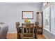 Comfortable dining area with wood table, matching chairs, and plenty of natural light at 6231 Indian Paintbrush St # 214, Frederick, CO 80530