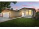 Lovely single Gathering home boasts verdant grass, attractive landscaping, and a welcoming front porch at 6231 Indian Paintbrush St # 214, Frederick, CO 80530