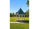 Picturesque gazebo in a park setting, surrounded by trees and green space at 6231 Indian Paintbrush St # 214, Frederick, CO 80530