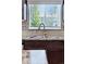 Close-up of the kitchen sink underneath the window looking out to the exterior at 6231 Indian Paintbrush St # 214, Frederick, CO 80530