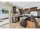 Modern kitchen features stainless steel appliances, a kitchen island, granite countertops, and patio access at 6231 Indian Paintbrush St # 214, Frederick, CO 80530
