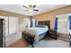 Comfortable bedroom features a ceiling fan, natural light and neutral carpeting at 6231 Indian Paintbrush St # 214, Frederick, CO 80530