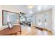 Inviting foyer with hardwood floors, decorative glass front door, and beautiful stained-glass window at 7464 Shoreham Pl, Castle Pines, CO 80108