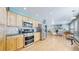 Updated kitchen with stainless steel appliances flows into an inviting living space at 7464 Shoreham Pl, Castle Pines, CO 80108