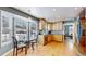 Bright kitchen with stainless appliances, a breakfast nook, and hardwood floors at 7464 Shoreham Pl, Castle Pines, CO 80108