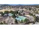 Community featuring tennis courts, a pool, and scenic views of the mountains at 7464 Shoreham Pl, Castle Pines, CO 80108