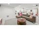 Open basement featuring a living area, music corner, and great lighting at 5078 S Quail St, Littleton, CO 80127