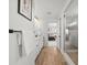 Bright bathroom leads to shower, and features modern hardware and a peek into the bedroom at 5078 S Quail St, Littleton, CO 80127