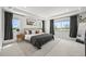 Bright bedroom features neutral walls, tray ceiling, large windows, and an elegant minimalist design at 5078 S Quail St, Littleton, CO 80127