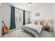 Cozy bedroom features window with natural light, plush carpet and stylish furnishings at 5078 S Quail St, Littleton, CO 80127