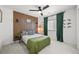 This bedroom features a wood accent wall and minimalist decorations at 5078 S Quail St, Littleton, CO 80127