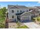 Stunning exterior of home featuring a manicured front lawn and welcoming curb appeal at 5078 S Quail St, Littleton, CO 80127