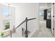 Bright staircase with large windows and views to the outdoors at 5078 S Quail St, Littleton, CO 80127