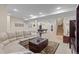 Expansive basement area with recessed lighting, comfortable seating, and a billiards table at 6132 S Boston Cir, Englewood, CO 80111