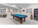 Entertainment area in basement featuring a pool table and comfortable seating, perfect for relaxing at 6132 S Boston Cir, Englewood, CO 80111