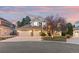 Charming two-story home with a well-manicured lawn and a spacious three-car garage at 6132 S Boston Cir, Englewood, CO 80111