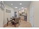 Charming kitchen space featuring a round dining table and adjacent cabinetry with stainless steel mini-fridge at 6132 S Boston Cir, Englewood, CO 80111
