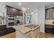 Gourmet kitchen island with granite countertops, stainless steel appliances, and ample storage at 6132 S Boston Cir, Englewood, CO 80111