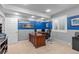 Functional office space featuring two-tone paint, ample desk space, and natural light from the window at 6132 S Boston Cir, Englewood, CO 80111