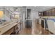 Spacious open concept layout with views of the living room, dining, and kitchen at 6132 S Boston Cir, Englewood, CO 80111