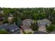 Aerial shot of suburban homes surrounded by lush trees with well-manicured lawns at 6132 S Boston Cir, Greenwood Village, CO 80111