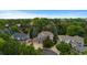 Aerial shot of a home nestled among lush trees in a serene neighborhood at 6132 S Boston Cir, Greenwood Village, CO 80111