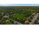 Expansive aerial view of neighborhood with mature trees, green spaces, and well-maintained streets at 6132 S Boston Cir, Greenwood Village, CO 80111