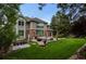 A beautifully landscaped backyard featuring a well-maintained lawn and outdoor seating area at 6132 S Boston Cir, Greenwood Village, CO 80111