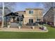 Outdoor patio with a covered pergola is perfect for entertaining in this well-maintained backyard at 11701 Elkhart St, Commerce City, CO 80603