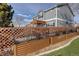 Backyard features privacy fence, pergola, and landscaped yard at 11701 Elkhart St, Commerce City, CO 80603