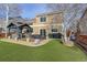 Well-maintained backyard featuring a gazebo, patio, and artificial grass perfect for outdoor enjoyment at 11701 Elkhart St, Commerce City, CO 80603