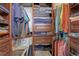 Organized walk-in closet with shelving, drawers, and hanging space for optimal storage at 11701 Elkhart St, Commerce City, CO 80603