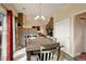 Open dining area with natural light, views of the living room, and modern décor elements at 11701 Elkhart St, Commerce City, CO 80603