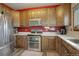 Well-appointed kitchen with stainless steel appliances, quartz countertops, and ample cabinetry at 11701 Elkhart St, Commerce City, CO 80603
