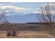 Scenic landscape view shows natural environment with mountain peaks in the distance at 11701 Elkhart St, Commerce City, CO 80603