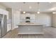 Modern kitchen with stainless steel appliances and large island at 14096 Black Sedge Cir, Parker, CO 80134