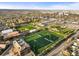 An aerial shot showcases sports fields, greenery, and infrastructure in the community at 4942 Grove St, Denver, CO 80221
