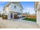 View of backyard featuring a well-kept yard, patio, and privacy fence at 4942 Grove St, Denver, CO 80221