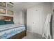 Bedroom with closet door and full-length mirror at 4942 Grove St, Denver, CO 80221