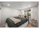 Cozy bedroom featuring recessed lighting, a comfortable bed, and a window for natural light at 4942 Grove St, Denver, CO 80221