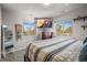 Bedroom with large windows and mountain view on television at 4942 Grove St, Denver, CO 80221