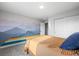 Bedroom features carpet, closet, bed with a mural on the wall at 4942 Grove St, Denver, CO 80221