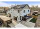 Exterior view of the home shows solar panels on the roof and a back patio area at 4942 Grove St, Denver, CO 80221