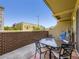 A balcony featuring a dining set, perfect for enjoying outdoor meals with a relaxing hammock nearby at 1441 Central # 305, Denver, CO 80211