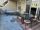 Relaxing balcony with a hammock, outdoor dining set, and a view, offering an inviting space for outdoor enjoyment at 1441 Central # 305, Denver, CO 80211