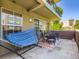 Outdoor patio featuring a comfortable hammock and dining set, ideal for relaxing and entertaining outdoors at 1441 Central # 305, Denver, CO 80211