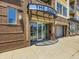Exterior shot of building entrance, sign reads 'The Dakota' and lists address '1447 Central Street' at 1441 Central # 305, Denver, CO 80211