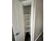 A storage closet with white shelving at 1441 Central # 305, Denver, CO 80211