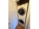 A laundry area featuring a stacked washer and dryer, conveniently located at 1441 Central # 305, Denver, CO 80211