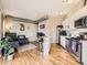 Stylish living space featuring hardwood floors, modern furniture, stainless steel appliances, and an open layout at 1441 Central # 305, Denver, CO 80211